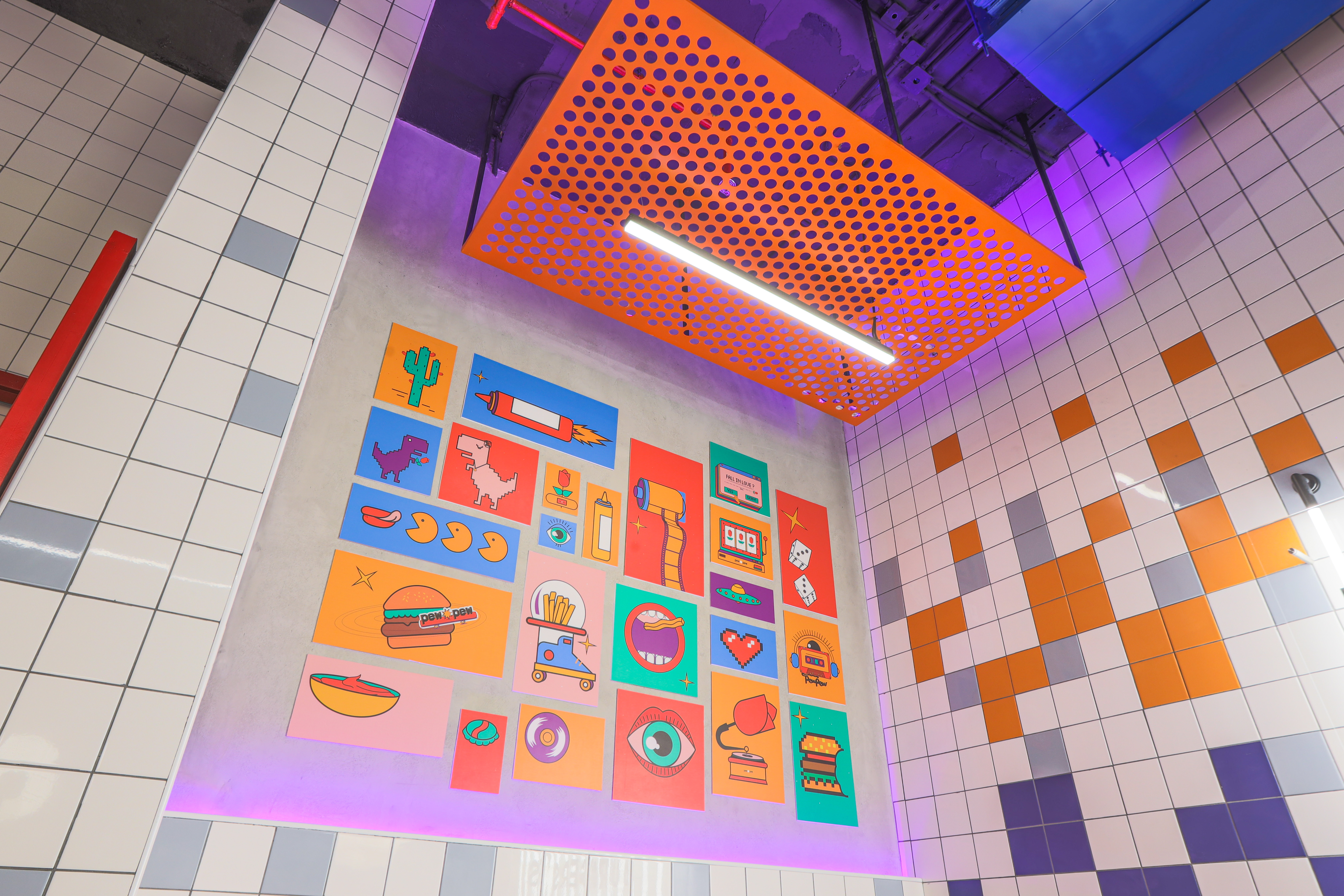 Pew Pew — perforated orange order counter with neon ORDER HERE sign